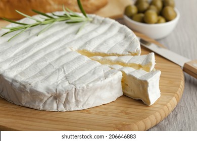 Fresh Brie Cheese And A Slice Close Up