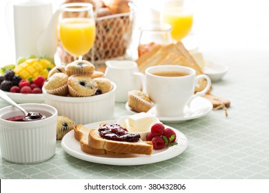 Fresh and bright continental breakfast table with jam on toast - Powered by Shutterstock