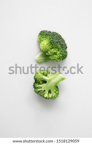 Similar – Small pieces of raw broccoli on white wood, Close up