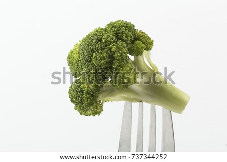 Similar – Small pieces of raw broccoli on white wood, Close up