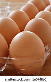 Fresh Brown Eggs In Plastic Carton.  Macro With Shallow Dof.  Selective Focus On Front Egg.