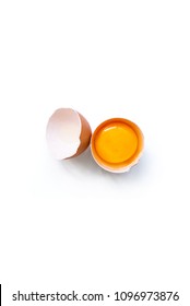 Fresh Brown Organic Chicken Egg Broken With Yolk And Egg White Isolated On White Background. Vertical Composition. Top View