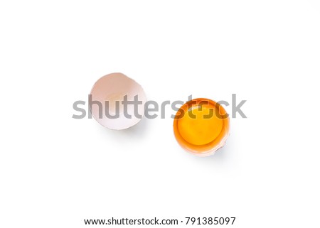 fresh brown organic chicken egg broken with yolk and egg white isolated on white background. Horizontal composition. Top view