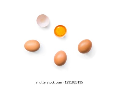 Fresh Brown Organic Chicken Eggs Broken With Yolk And Egg White Isolated On White Background. Horizontal Composition. Top View