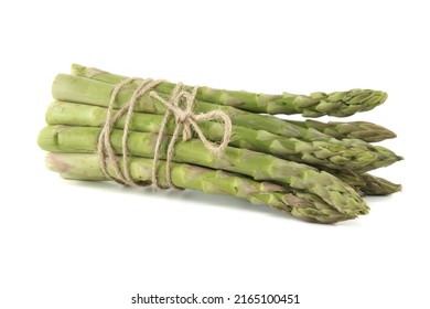 Fresh bunch of green asparagus tied with jute cord isolated on white background. Spring vegetable, eco friendly packaging