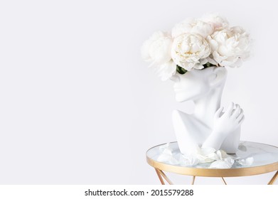 Fresh Bunch Of White Peonies In Vase In Shape Of Womens Face On Light Background. Trendy Ceramic Vase Of Human Head, Handmade Modern Statue Art Flower Vase. Card Concept, Copy Space For Text