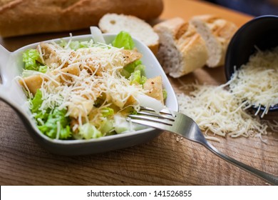 Fresh Caesar Salad On Bowl With Parmesan Cheese