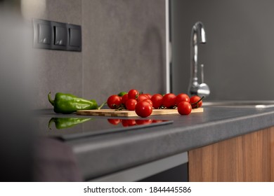 Fresh Campari Tomatoes And Green Peppers On A Modern Kitchen