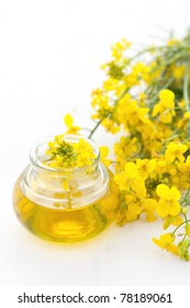 Fresh Canola Oil With Rapeseed Blossoms