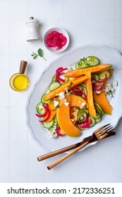 Fresh Cantaloupe Melon Salad With Cucumber, Feta, Pickled Red Onions And Mint. Top View, Overhead, Flat Lay