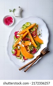 Fresh Cantaloupe Melon Salad With Cucumber, Feta, Pickled Red Onions And Mint. Top View, Overhead, Flat Lay