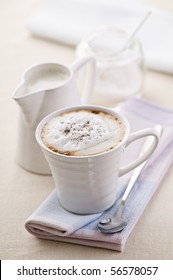 Fresh cappuccino with milk and sugar close up shoot