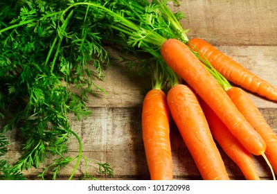 fresh carrots bunch on wood - Powered by Shutterstock