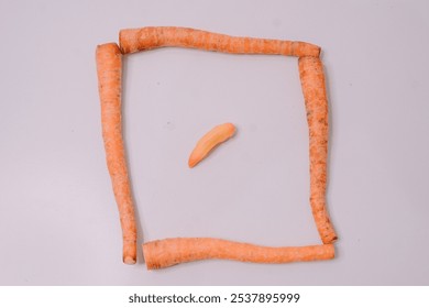 Fresh carrots displayed against a clean white background, highlighting their vibrant orange color and crisp texture, perfect for promoting healthy eating and farm-fresh produce - Powered by Shutterstock