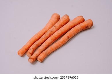 Fresh carrots displayed against a clean white background, highlighting their vibrant orange color and crisp texture, perfect for promoting healthy eating and farm-fresh produce - Powered by Shutterstock