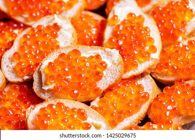 Fresh caviar on bread. Russian zukusk. Bread with butter. Sandwich with caviar. Russian caviar.
