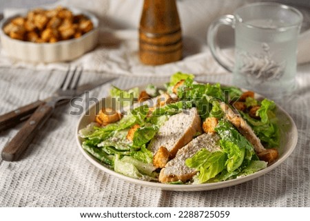 Fresh ceasar salad with grilled chicken and croutons