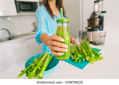 Fresh Celery Detox Juice. Healthy Woman Offering Bottle Of Freshly Pressed Juice In Juicer Machine. Healthy Detox Diet.