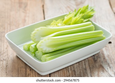 Fresh Celery Stick On White Dish