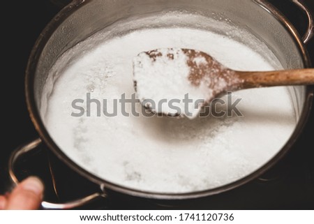 Fresh cheese making process, clotted cheese in a saucepan, homemade cotton, curd cheese or paneer