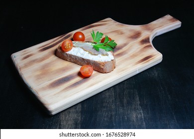 Fresh Cheese Toast With Anchovy Cured In Olive Oil With A Fresh Parsley Leaf