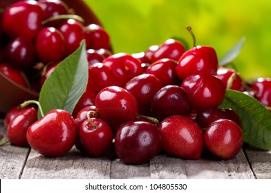 Fresh Cherries On Wooden Table