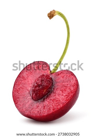 Fresh cherry half slice isolated on white.