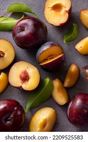 Fresh Cherry Plum Fruits In Black Bowl, Dark And Moody Food Photo.