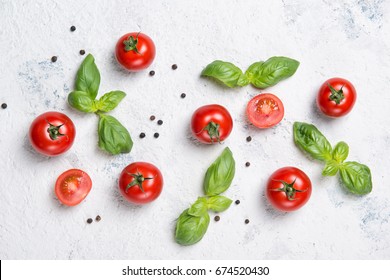 Fresh Cherry Tomatoes With Basil Leaves And Black Pepper On A Stone Table, Vegetable Pattern, Top View