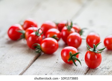Fresh cherry tomatoes on rustic wooden background. fresh organic vegetables freshly harvested from  farmers.  Healthy food