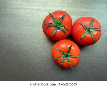 Fresh cherry tomatoes on rustic wooden background. Harvesting tomatoes - Shutterstock ID 1706275669