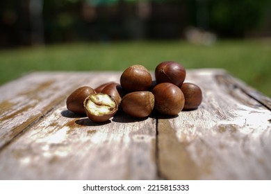 Fresh Chestnuts Isolated On A Wooden Floor, Chestnuts Have An Oily Sweet Taste.