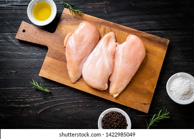 fresh chicken breast raw on cutting board