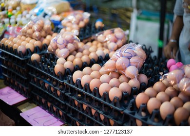 Fresh Chicken Eggs That Are Packed In Bags And In Panels With Many Sizes, Many Prices In The Evening Market In Thailand Concept Of Buying Raw Materials For Cooking