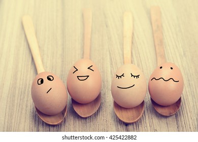 Fresh Chicken Eggs In Wooden Spoon On Wood Table.emotion