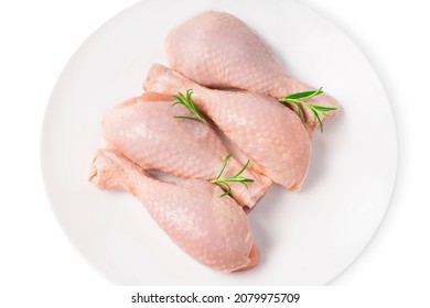 Fresh Chicken Legs Close-up Isolade.Top View Of A Four-piece Raw Whole Chicken Leg On A White Plate On A White Isolated Background.