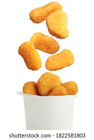 Fresh chicken nuggets falling into container on white background