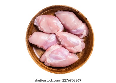 Fresh Chicken thigh meat, Raw Boneless and skinless fillet in a wooden plate. Isolated on white background.