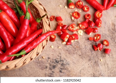 Fresh chilli on wooden - Shutterstock ID 1182925042