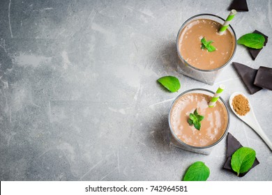 Fresh Chocolate Mint Shake In Glasses On Concrete Background. Top View, Copy Space.