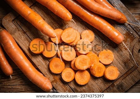 Fresh chopped carrots on a cutting board.