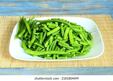 fresh chopped or cut indian vegetable green cluster beans or guar beans in dish ready for cooking