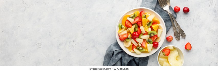 Fresh chopped fruit salad in a bowl. Long banner format. - Powered by Shutterstock