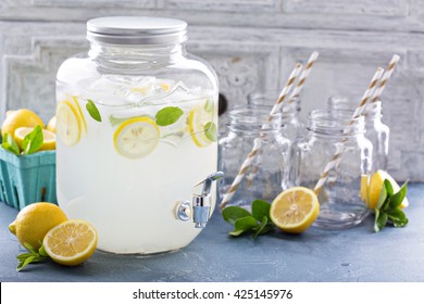 Fresh Citrus Lemonade With Lemons In Beverage Dispenser