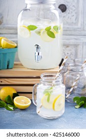 Fresh Citrus Lemonade With Lemons In Beverage Dispenser