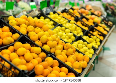 Fresh Citrus Are On The Shelf In The Store. A Variety Of Citrus Fruits. Oranges, Tangerines, Lime, Lemons. Supermarket 