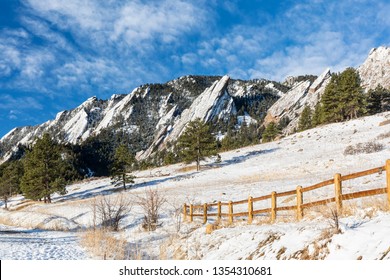 A fresh coating of snow coats the Flations rock formations, seen from Chautauqua Park in Boulder, Colorado