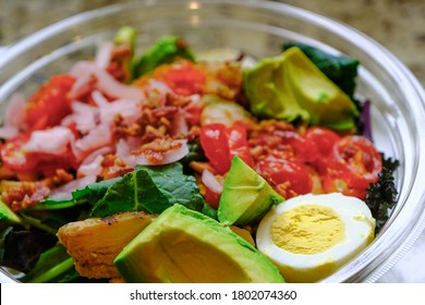 Fresh Cobb Salad In A Clear Plastic Bowl