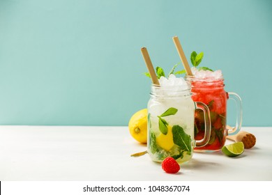 Fresh cocktail drinks with ice fruit and herb decoration. Alcoholic non-alcoholic drink-beverage. Mojito on blue background - Shutterstock ID 1048367074