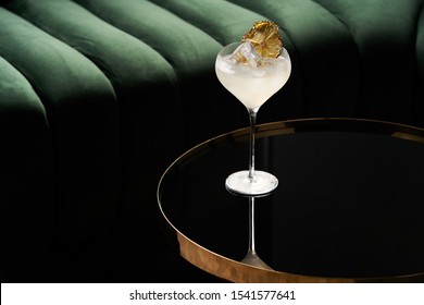 Fresh Cocktail Glass On Glass Table In Night Club Restaurant. Alcohol Cocktail Drink, Close-up. Retro Alcoholic Beverage